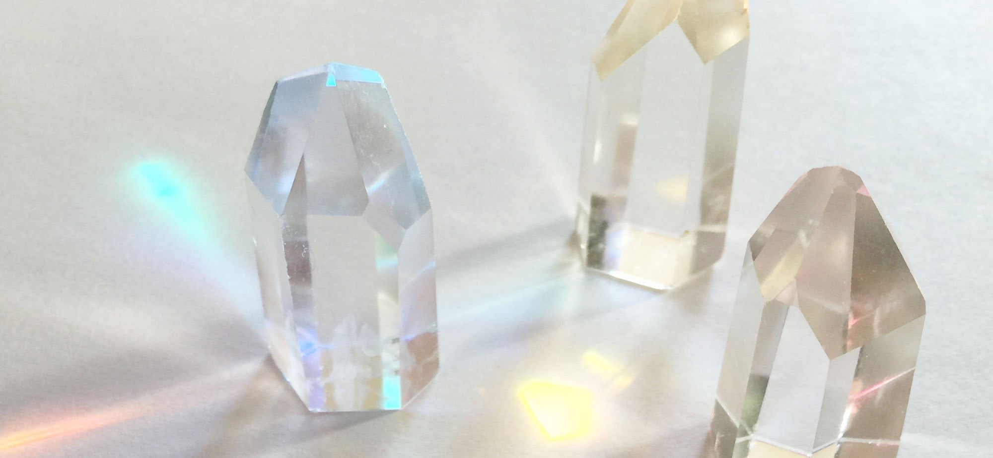 Crystal grid refracting prisms of light, and aiding in healing and manifestation